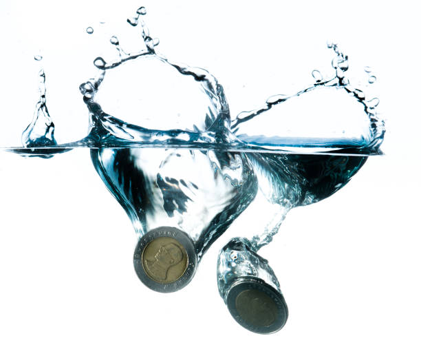 istock money in water with bubbles on white background 491939879