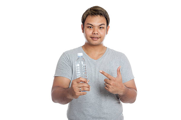istock Asian strong man point to a bottle of water 491941005