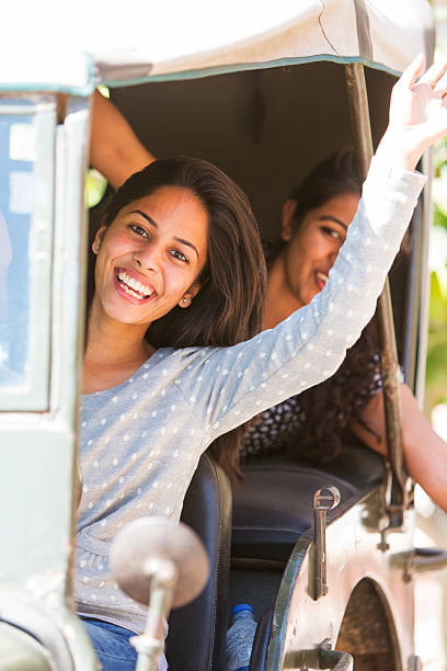 istock Indian Friends Waving in a Car 491944129