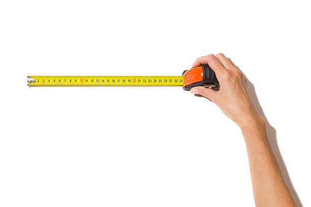 istock Roll Measuring Tape In Woman's Hand 491949188