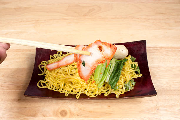 istock Pork dry noodles on wooden table 491949204