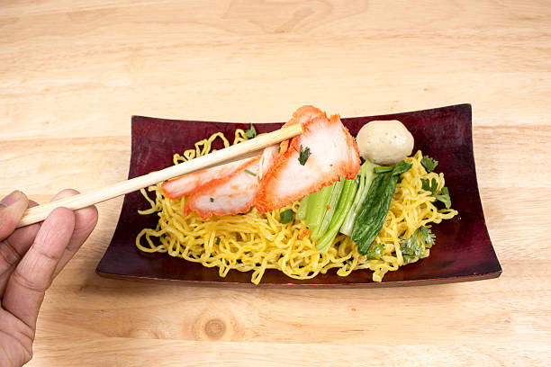 istock Pork dry noodles on wooden table 491949264