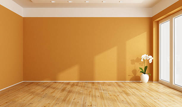 Empty orange room Empty orange room with wooden floor -3D Rendering unfurnished stock pictures, royalty-free photos & images