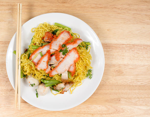istock Pork dry noodles on wooden table 491950540