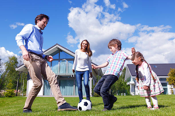 istock family playing football 491952232