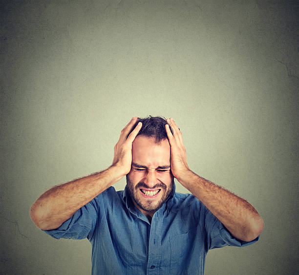 istock stressed man upset frustrated. Negative human emotions 491952620