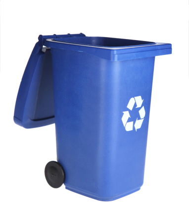 Blue, yellow and green open tank for separate garbage collection on a light background, waste recycling and conservation of the environment concept