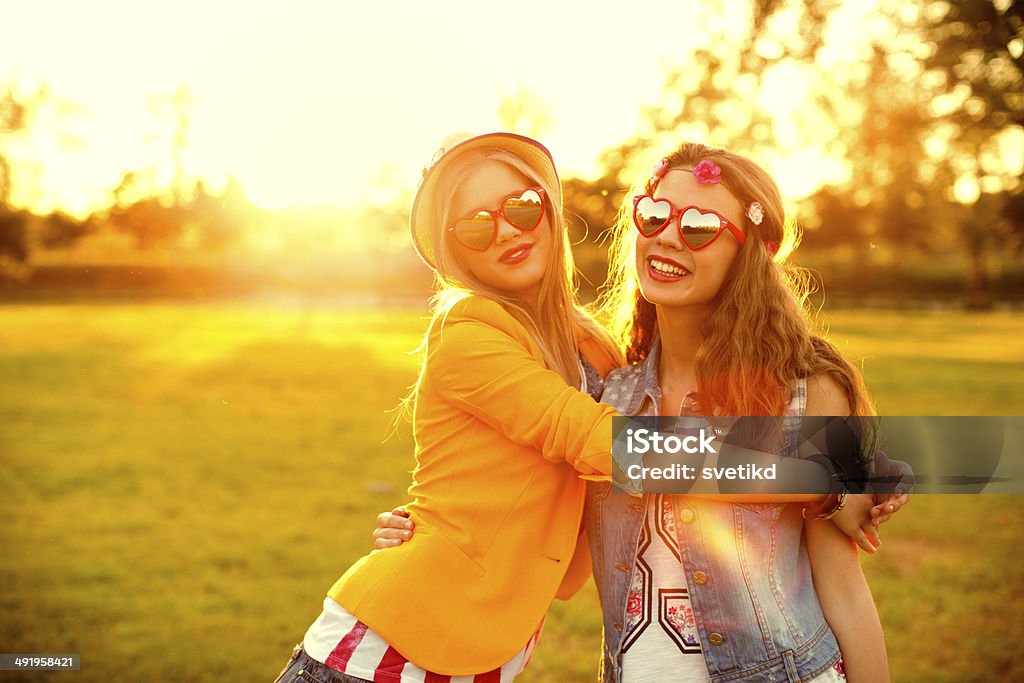 Young women enjoying outdoors. Young women enjoying outdoors in sunset. Adult Stock Photo