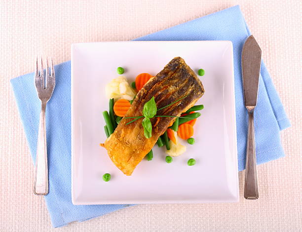istock Fried carp fish fillet with vegetables 491958777