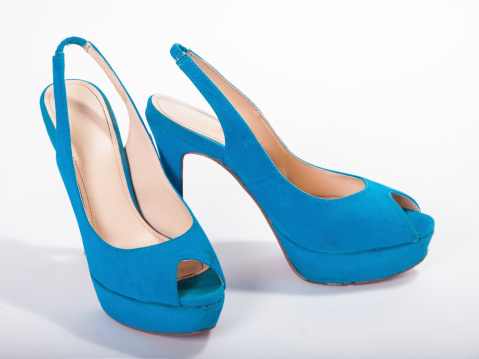 Blue high-heeled shoes on a white background