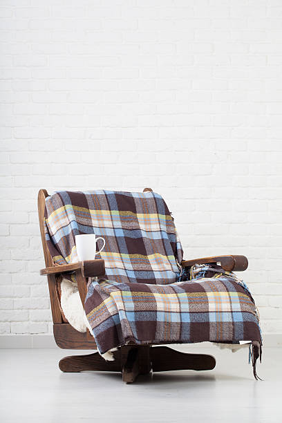 istock vintage armchair on white wall. 491961406