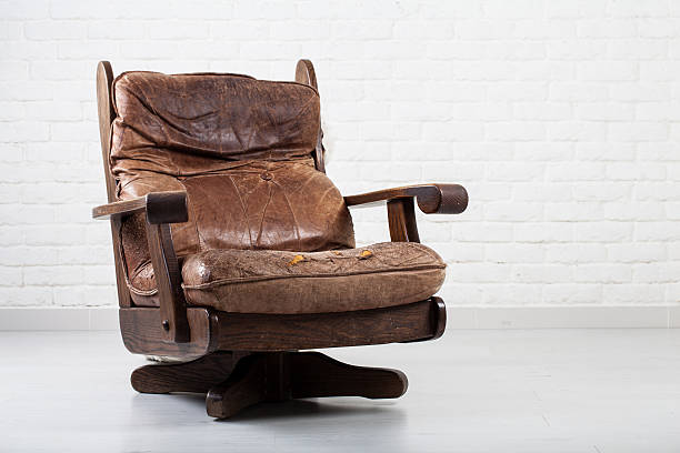 Vintage  brown leather sofa isolated on white background.