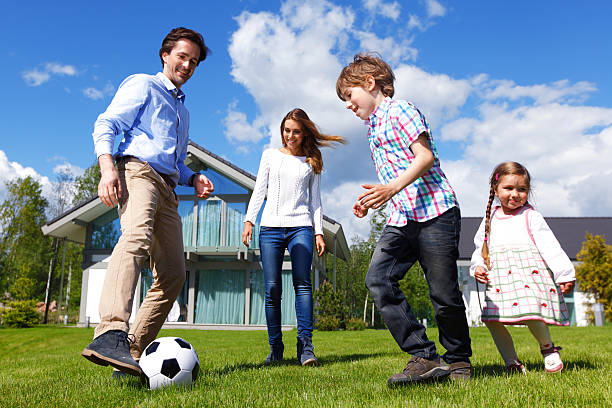 istock family playing football 491962554