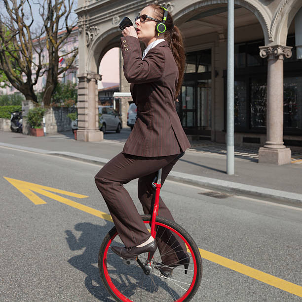 istock businesswoman with unicycle 491974478