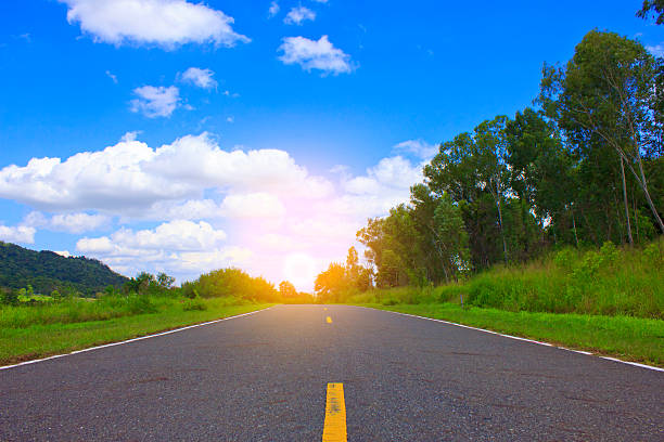 istock Beautiful countryside road under blue sky 491975936