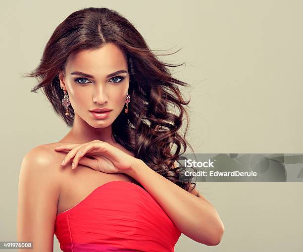 Brunette With Long Curled Hair Stock Photo - Download Image Now - Women, 2015, Adult