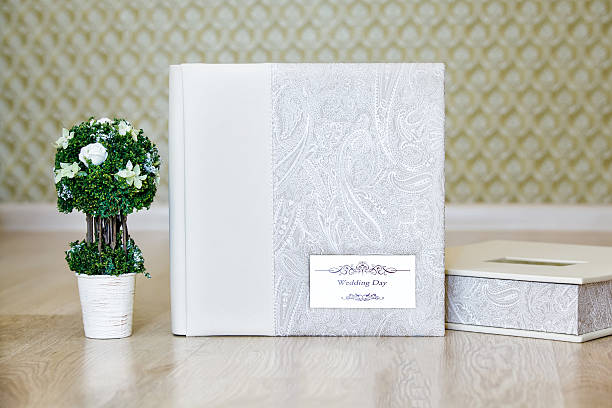 istock Composition of wedding photo album and decorative tree 491976446