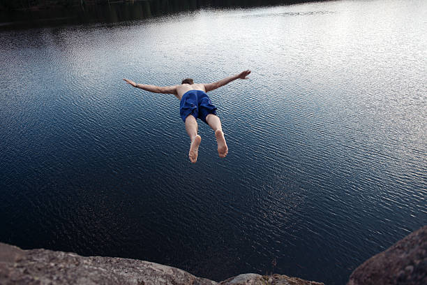 istock Man jumping into the water 491976602