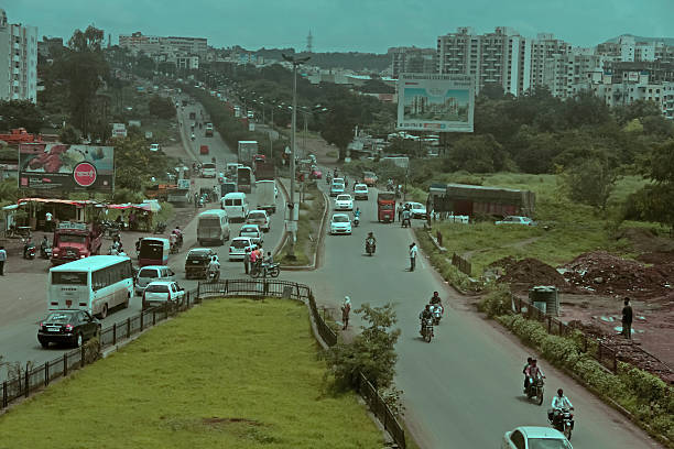 View of Pune in summer, Cityscape Skyline, buildings holdings, Signboards, and banners, Pune, Maharashtra, India - 30 April 2024
