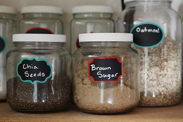 pantry jars of chia seeds, and brown sugar stock photo