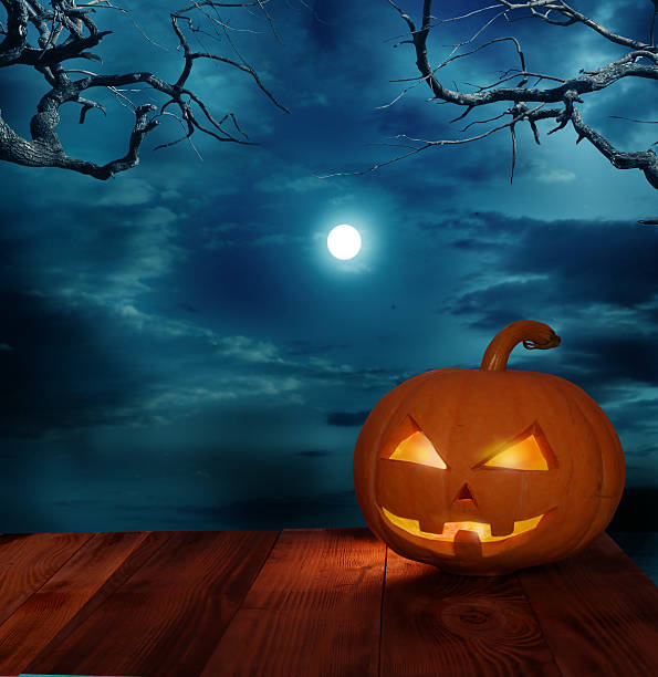 istock halloween pumpkin on wooden table 491986932