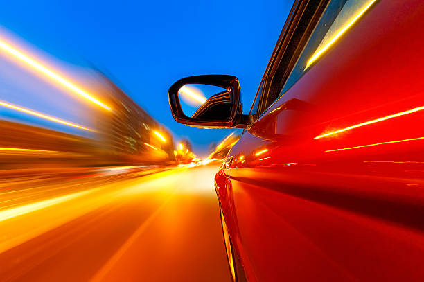 istock car on the road with motion blur background. 491990277