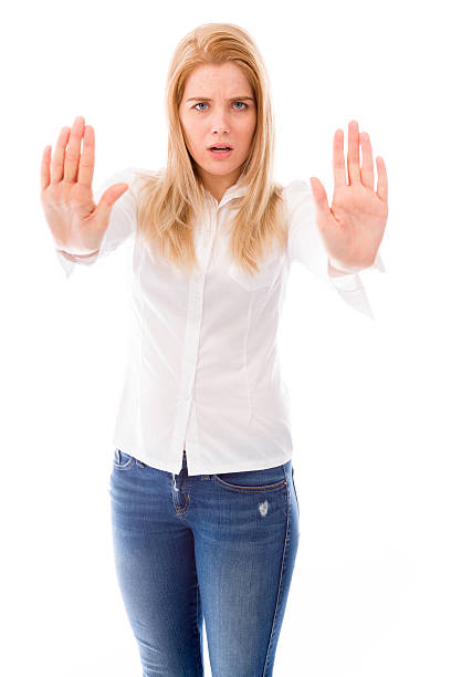 istock Young woman making stop gesture sign 491990679