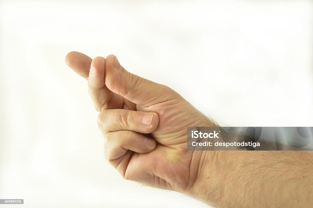 The crackling of the thumb and index finger The crackling of the thumb and index finger, hand isolated on white background Adult Stock Photo