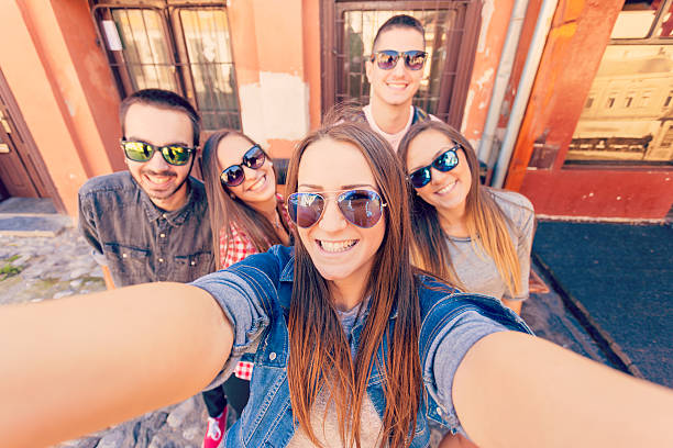 istock Young friends laughing and taking selfie 491991418