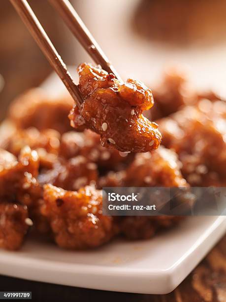 Eating Chinese Chicken With Chopsticks Stock Photo - Download Image Now - Asia, Chicken Meat, Chinese Food