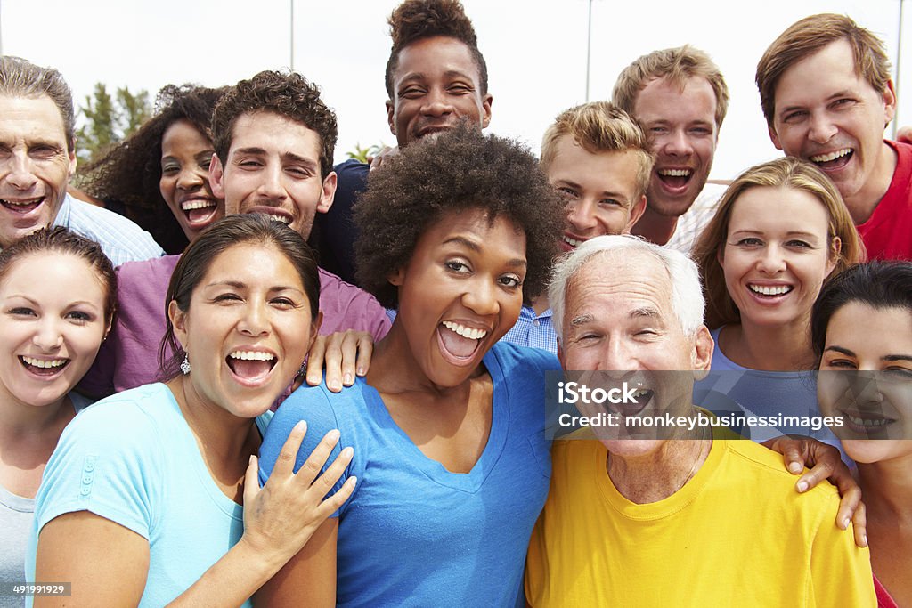 Outdoor Portrait Of Multi-Ethnic Crowd Outdoor Portrait Of Multi-Ethnic Crowd Smiling To Camera Multiracial Group Stock Photo