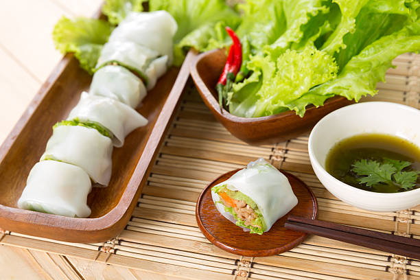 istock Portion of spring rolls with spicy sauce 491992338
