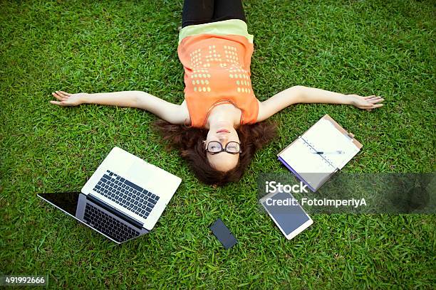 Freelancer Girl From The Device Laptop Tablet Player Noteboo Stock Photo - Download Image Now