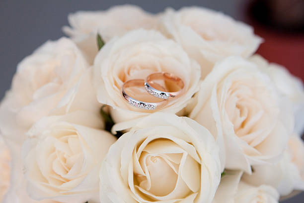 istock Gold ring on wedding bunch of flowers 491992763