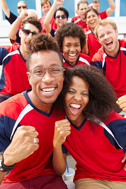 istock Spectators In Team Colors Watching Sports Event 491993027