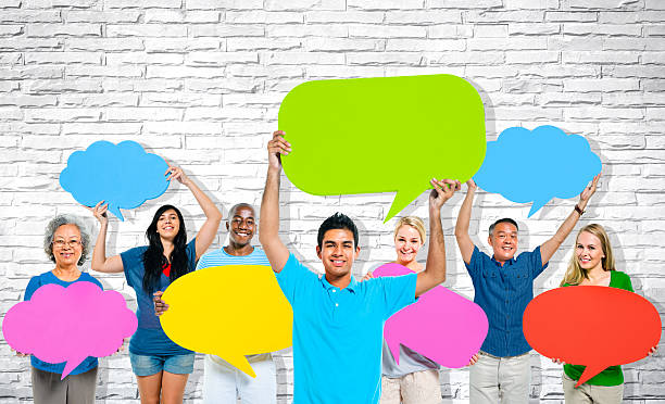 istock Multiethnic Group of People Holding Colourful Speech Bubbles 491994491