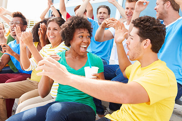 istock Spectators In Team Colors Watching Sports Event 491995249