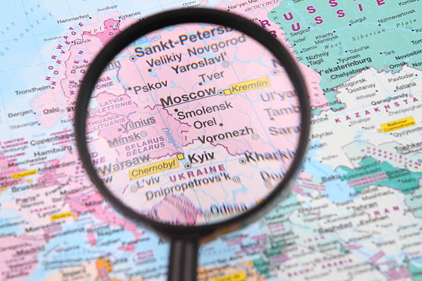 Moscow and Kyiv on the map. Magnifying glass over a map of Moscow and Kyiv area. dnipropetrovsk stock pictures, royalty-free photos & images