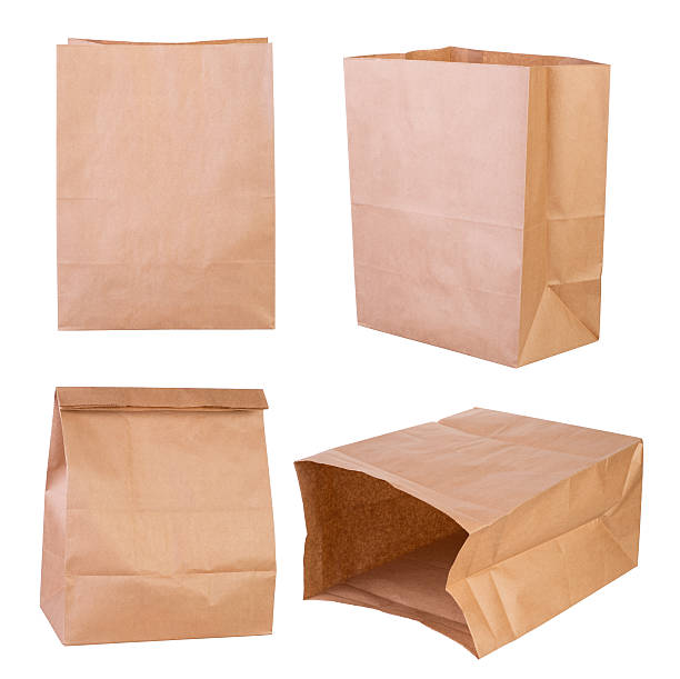 Brown paper bags Brown paper bags isolated on white background paper bag stock pictures, royalty-free photos & images