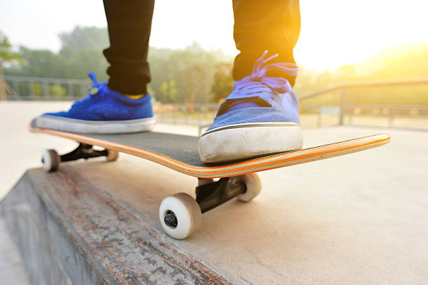 istock Legs in sneakers on a skateboard 491995797
