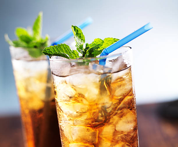 istock iced tea with blue straw and mint garnish 491996711