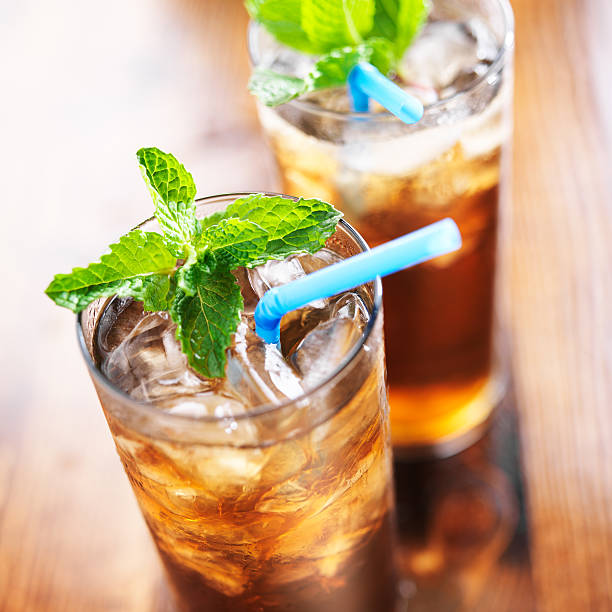 istock iced tea with blue straw and mint garnish 491996931