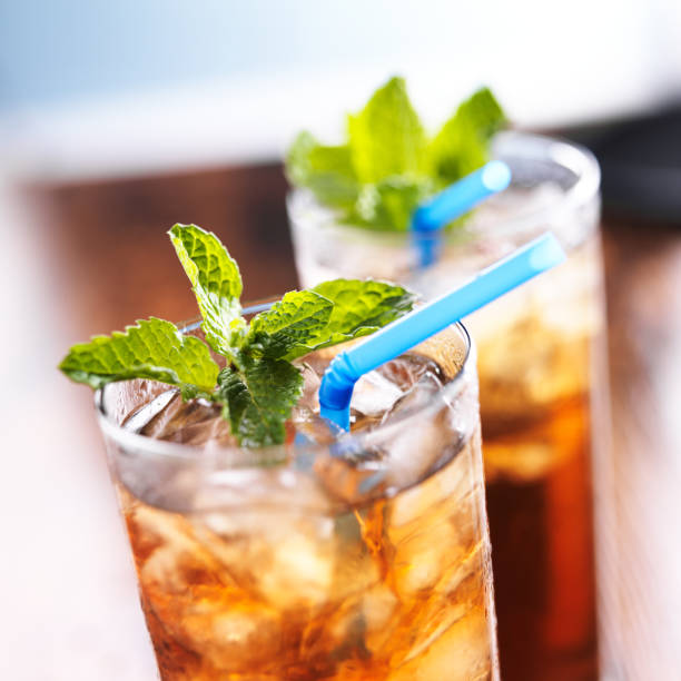 istock iced sweet tea close up with blue straw 491996983