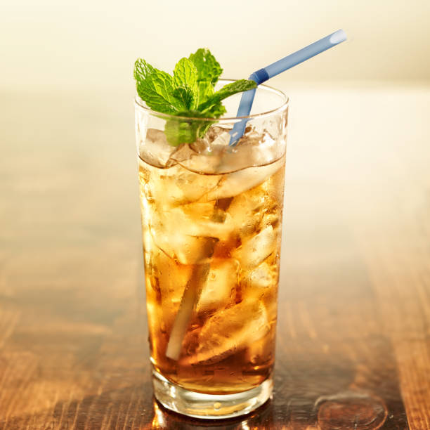 istock golden iced tea with blue straw and mint 491997039