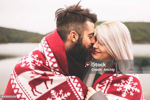 Couple Outside Under The Blanket Stock Photo - Download Image Now - Blanket, Couple - Relationship, Cold Temperature