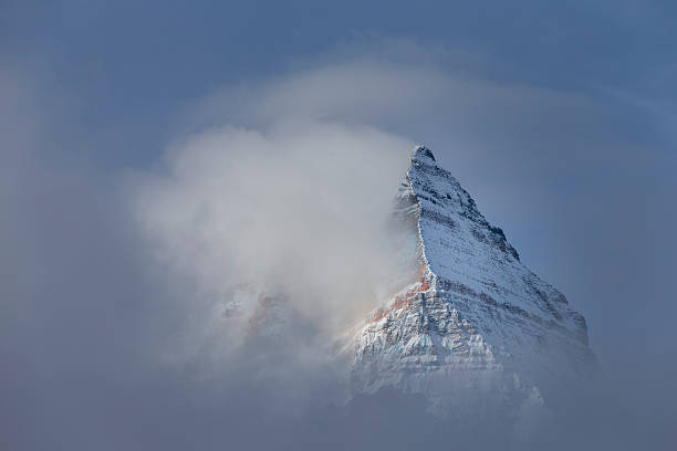 istock Pyramid Shaped Mount Assiniboine in the Fog 492002612