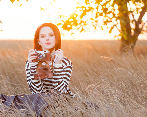istock Woman with vintage camera 492002872
