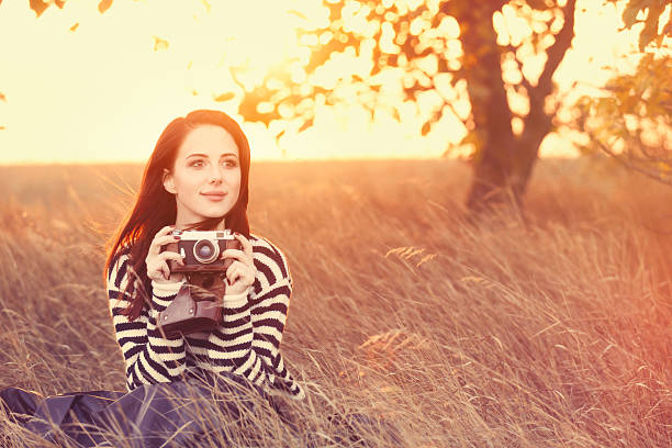 istock Woman with vintage camera 492002904