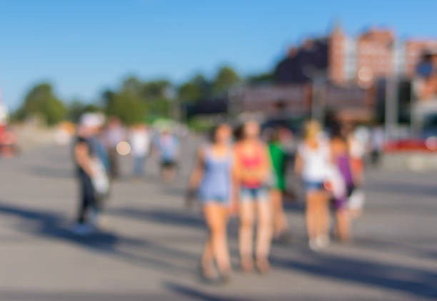 istock Blurry background - young people in summer city 492003264