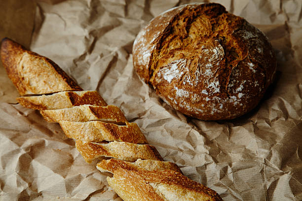 istock Sliced baguette and rye bread on craft paper 492003302